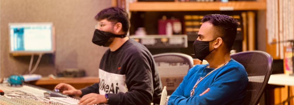 FIREANT STUDIO showing the importance of Accessibility two students at computer wearing mask