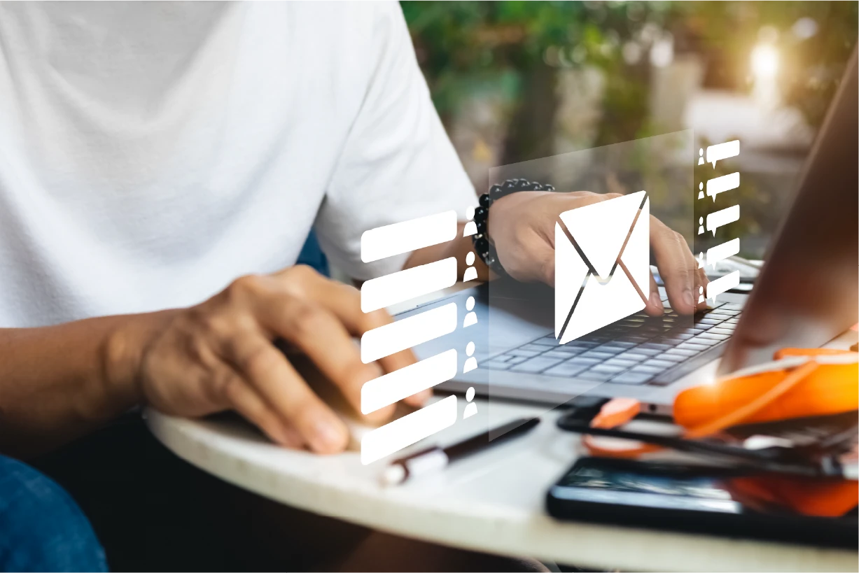 Man sitting at computer sending emails