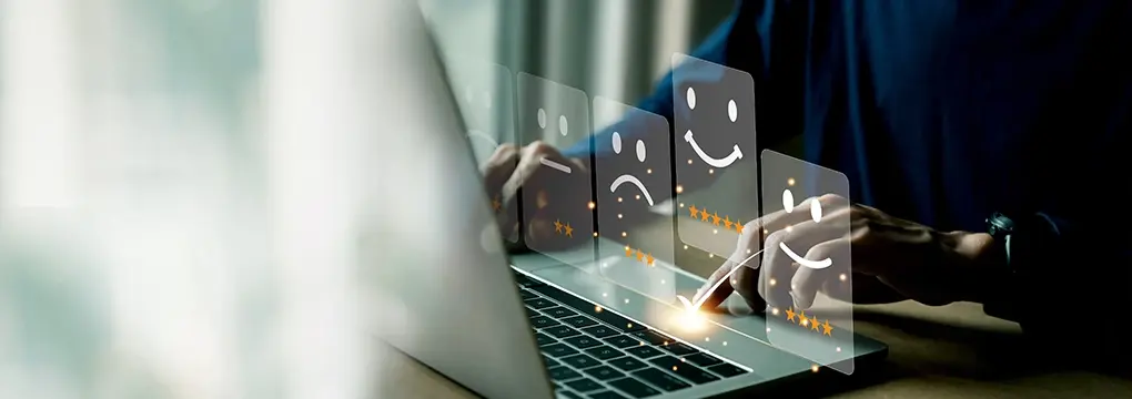 Hands on a laptop with 3, 4, and 5 star ratings superimposed on top.