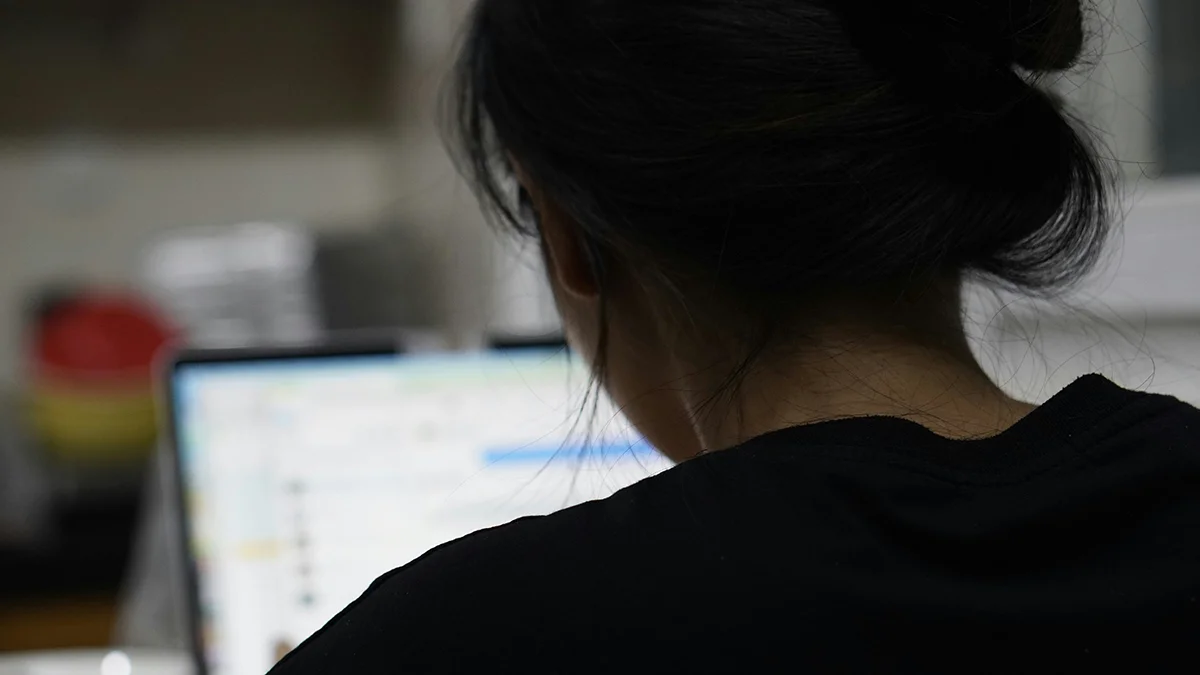 Individual at computer performing Accessibility user testing on a website